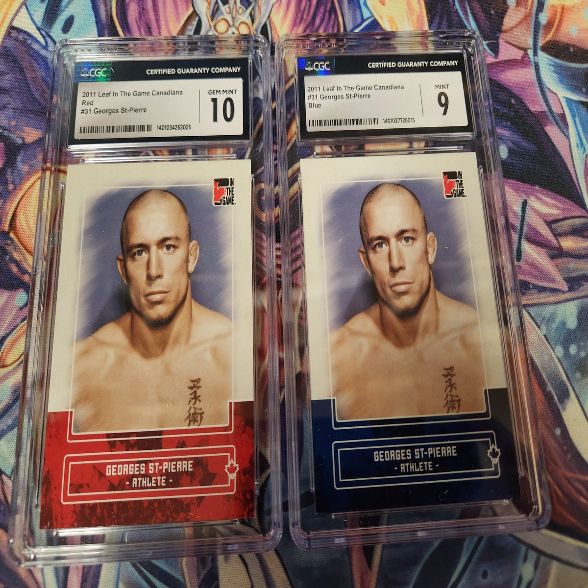 1x 2011 ITG In The Game Canadiana Georges St-Pierre #31 Blue Sapphire Print Run of 50/Red Ruby Print Run of 180 UFC (CGC Graded 9 to 10) (For 1 Card)(Will Be Different Card From